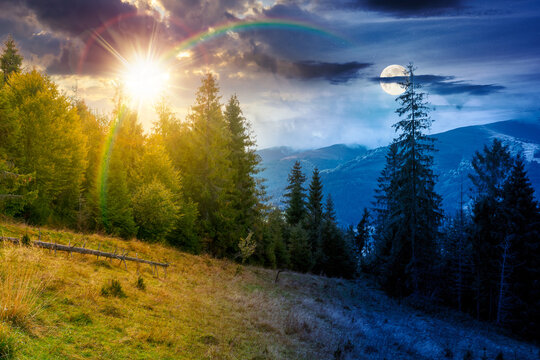 mountain landscape ukraine with spruce forest. day meet night. sun and moon over rural valley of podobovets in the distance. epic sky. equinox background for carpathian countryside adventures