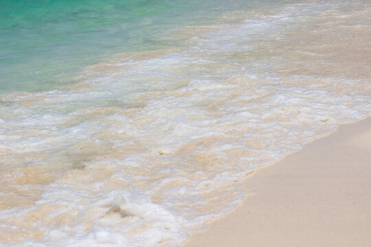Summer leisure beach with blue sea, golden sand and waves