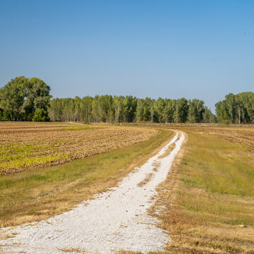 Steamboat Trace Trail converted from old railroad running across farmland and corn field near Peru, Nebraska