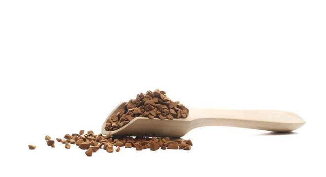 Instant coffee granules, soluble coffee in wooden spoon isolated white clipping, side view