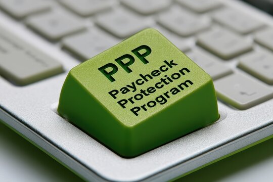 Close-up of a vivid green keyboard key engraved with PPP and Paycheck Protection Program