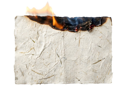 Rectangular sheet of textured handmade paper with bright orange flames consuming the top edge while burning on transparent background