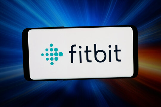 Stuttgart, Germany - 07-10-2026: In this photo illustration, the logo of US wearables company Google Fitbit is displayed on a smartphone in front of abstract background on computer screen.