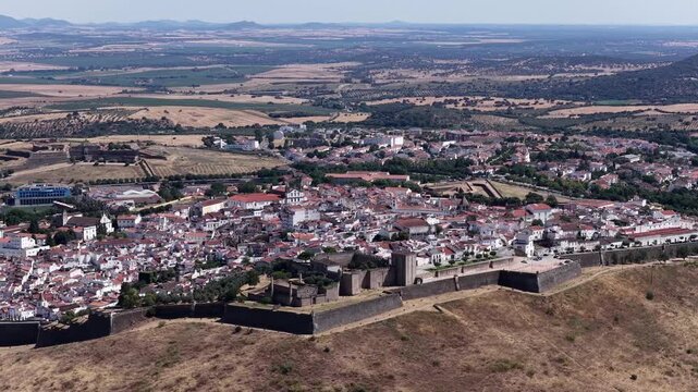 Aerial landscape of medieval Elvas castle walls surrounding picturesque whitewashed buildings in the heart of historic Alentejo, Portugal