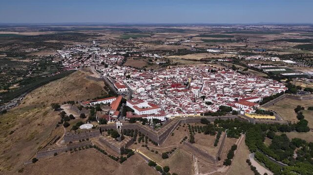Panoramic aerial view of historic Elvas city walls and castle fortifications surrounding traditional white buildings in Portugal's scenic Alentejo zone