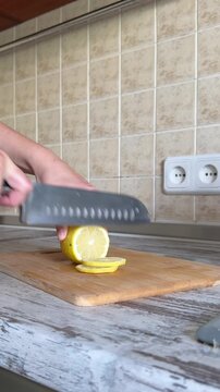 Slicing Fresh Yellow Lemon Close Up