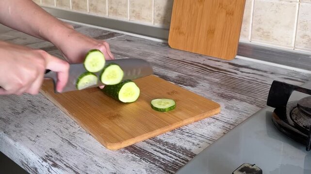 Slicing Fresh Cucumber Close Up