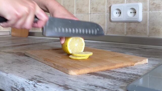 Slicing Fresh Yellow Lemon Close Up