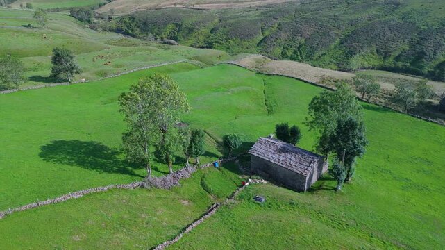 Aerial view from a drone of the winter landscape around the village of Vega de Pas. Pasiegos Valleys region, Cantabria, Spain, Europe