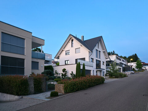 germany, peaceful sunset along sonnensiedlung street in modern elzach residential district surrounded by beautiful schwarzwald summer landscape and blue sky