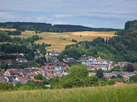 germany, sweeping panorama above elzach black forest village overlooking peaceful valley beneath glowing sunset and vibrant colorful summer evening horizon
