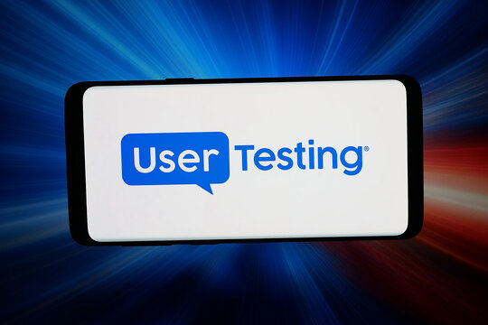 Stuttgart, Germany - 07-10-2026: In this photo illustration, the logo of US testing platform company UserTesting Group is displayed on a smartphone in front of abstract background on computer screen.