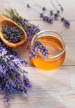 Lavender honey jar with fresh herbs and dried flowers