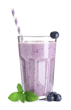 Tasty smoothie in glass, fresh blueberries and mint isolated on white