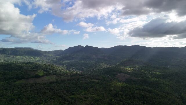 Green mountain valley landscape on blue sky background aerial view