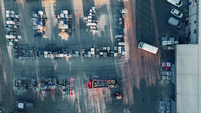 Aerial view of a cluttered vehicle yard. Industrial chemical plant