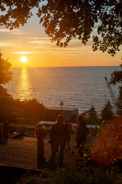 Sunset over the Baltic Sea with silhouettes of people in Svetlogorsk