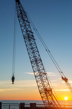 Crane silhouette against sunset over the Baltic Sea in Svetlogorsk