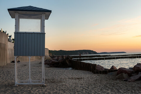 Lifeguard tower on sandy beach at sunset near Baltic Sea in Svetlogorsk
