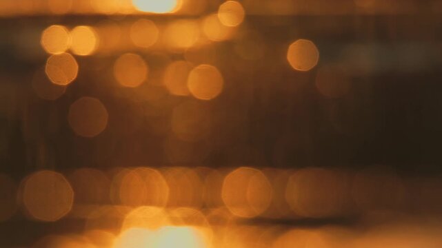 Reflection of sunset in water for natural background with glow and glitter