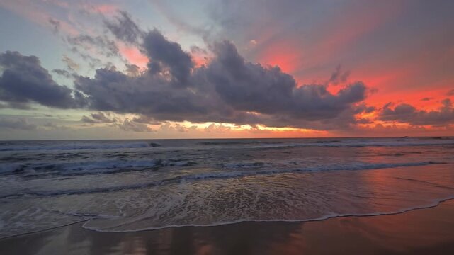 Beautiful ocean scenery with calm waves, colorful skies, and natural light during sunrise and sunset. A peaceful coastal landscape with a cinematic atmosphere, ideal for travel, tourism, nature, relax