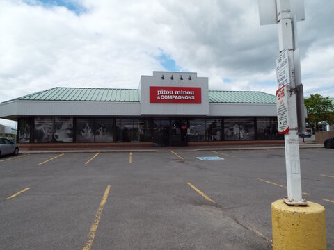Aylmer,Quebec, Canada &ndash; May 24, 2026: The front of the "Pitou Minou & Compagnons" retail store features a prominent sign and a large, empty parking lot area at 375 Chem. d'Aylmer.