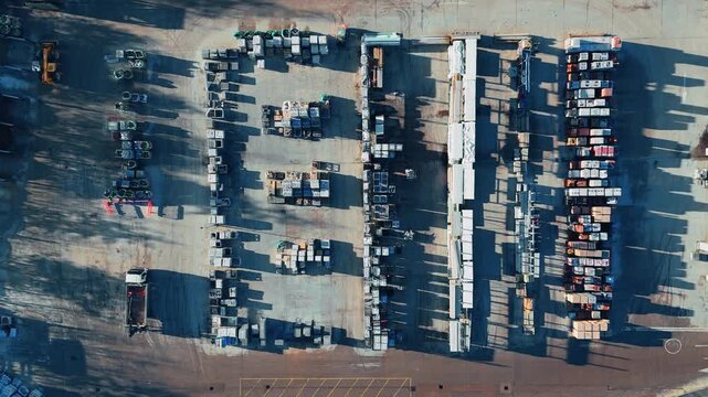 Aerial view shows a cluttered industrial yard. Industrial chemical plant