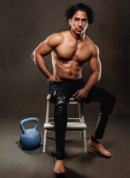 Strong man with bionic legs demonstrating fitness