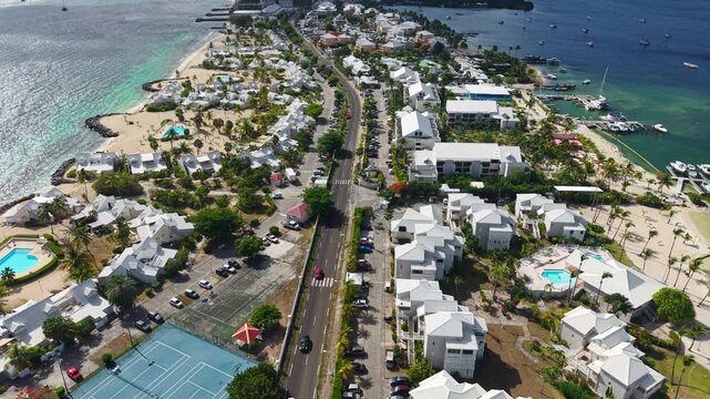 Drone Shot of Saint Martin Island, Sandy Ground Street Traffic, Buildings by Caribbean Sea and Simpson Bay Lagoon