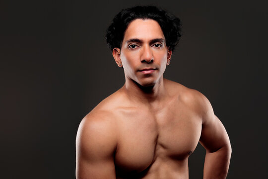 Muscular latino man representing strength and fitness goals