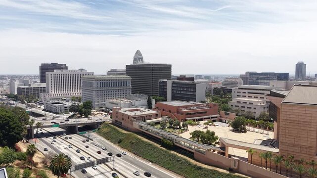 Drone Shot of Downtown Los Angeles, City Hall, Courthouse Buildings and Traffic on US-101 Highway, California USA