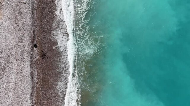 Turquoise Sea Waves Along the Coast