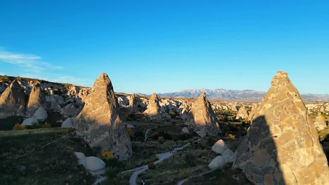 Aerial view of fairy chimneys and rock formations in cappadocia, turkey at sunrise