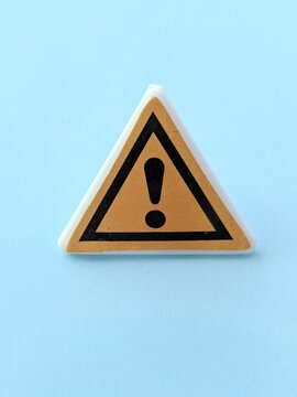 warning triangle sign. Triangular caution sign with exclamation mark symbol on yellow background, universally recognized for safety warnings and hazard alerts.