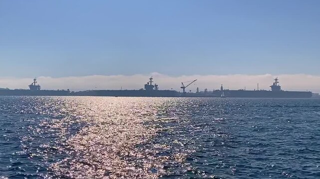 Panoramic view from the shore of the bay, yachts, and the landscape on the opposite bank.
