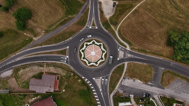 Top Down Drone Shot of Roundabout Traffic With Star Shape Inside Circle, Birdseye Aerial View