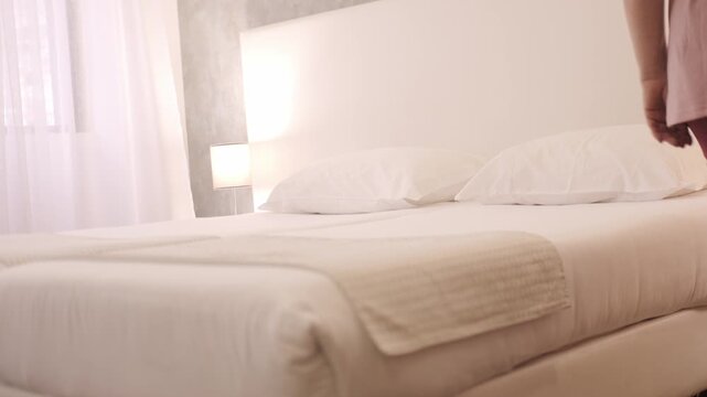 Full-figured woman 50 making bed, dancing lightly near mattress, home chore, joyful routine, domestic life, morning activity, gently dancing to unseen music, Joyful housework moment