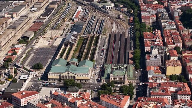 Drone Shot of Trieste Centrale Railway Station, Former and Actual WIth Train Moving on Railroad, Italy