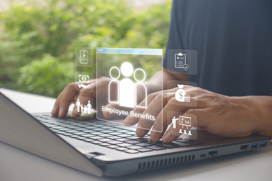 Business professional using laptop with virtual employee benefits , human resource management, compensation package, insurance, payroll, healthcare, workforce planning in modern corporate office.