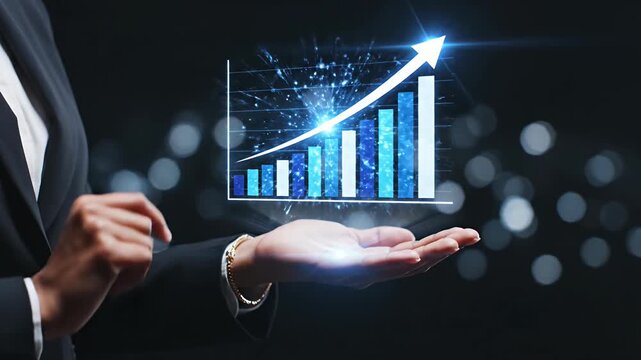 Businessman holding glowing blue financial bar graph icon