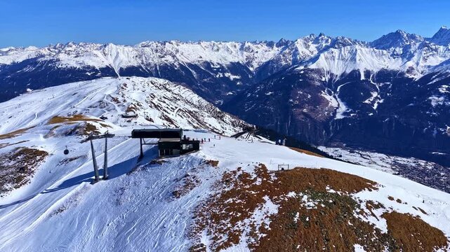 Snow-covered mountains and ski lift in Serfaus-Fiss-Ladis, Austria, panoramic alpine winter landscape.