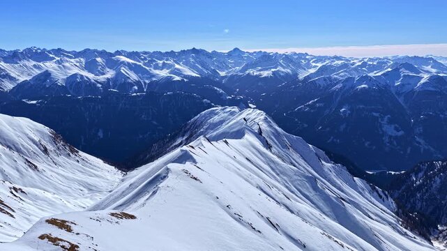 Panoramic view of snow-covered mountains in Serfaus-Fiss-Ladis, Austria.