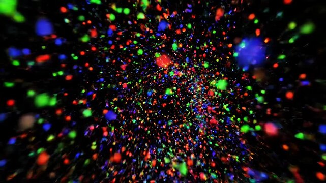 Colorful abstract bokeh particles on black background.