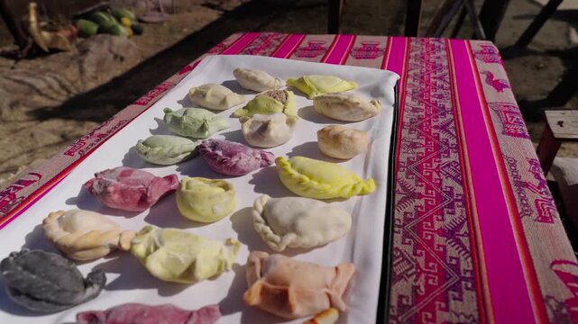 Close Up Dolly Shot of Colorful Traditional Empanadas on Platter Tucuman Argentina