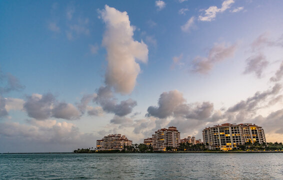 Miami on sunrise, Florida. Sunrise view of Fisher island. Luxury condominiums. Fisher island cityscape. Luxury building of Fisher island, Miami. Miami beach cityscape