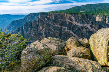 Dramatic close-up of the Painted Wall's pale pegmatite dike streaks across dark schist cliff face, Black Canyon of the Gunnison NP, Colorado. © ZL Visuals