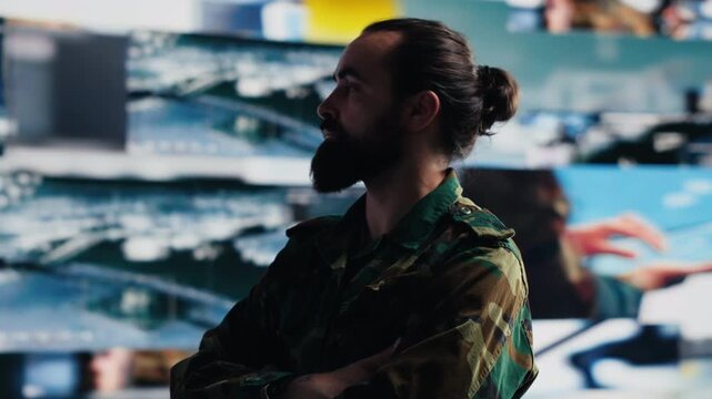 Veteran analyzes battlefield data, military tactics and geopolitical information in a high technology command center used for planning and national protection.