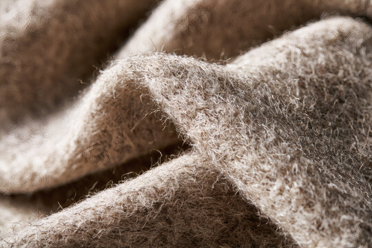 Soft beige fuzzy felt fabric folds texture