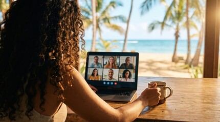 Naklejka premium Curly haired woman joining video conference on laptop at tropical beach resort for remote work and digital nomad lifestyle campaign.