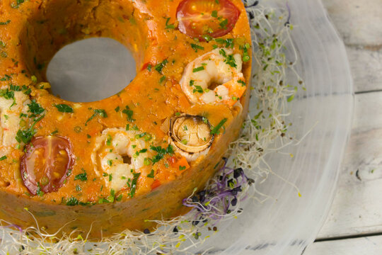 Traditional Brazilian cuscuz paulista savory cornmeal cake.